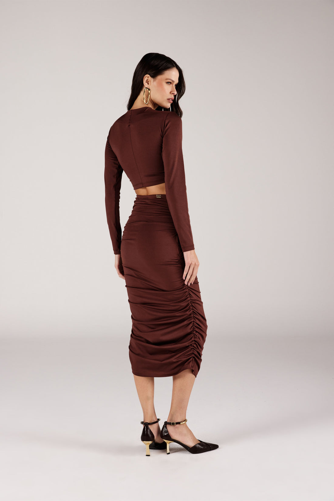 SAIA CURTA FEMININA TRANSPASSE LATERAL COM TACHAS ONÇA PRETA